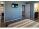 Carpeted bedroom featuring a TV, an open door to the bathroom and walk-in closet at 11702 Tetrafin Dr, Riverview, FL 33579