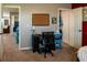 Carpeted bedroom featuring an open door to the closet and a desk with a chair at 11702 Tetrafin Dr, Riverview, FL 33579