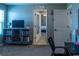 Bedroom with a TV on a dresser, and a view into another bedroom through an open door at 11702 Tetrafin Dr, Riverview, FL 33579