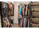 Organized walk-in closet with ample hanging space and shelving for storage at 11702 Tetrafin Dr, Riverview, FL 33579