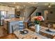 Open-concept dining area next to the kitchen features a table, chairs, and pendant lighting at 11702 Tetrafin Dr, Riverview, FL 33579