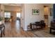 Welcoming entryway with wood-look tile flooring leading to the dining and living areas at 11702 Tetrafin Dr, Riverview, FL 33579