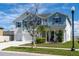 Charming two-story home boasts a three-car garage and beautifully maintained landscaping at 11702 Tetrafin Dr, Riverview, FL 33579