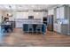 Bright kitchen with a center island, stainless steel appliances, and an open concept layout to the dining area at 11702 Tetrafin Dr, Riverview, FL 33579