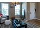 Cozy living room with natural light, decorative mirror, and comfortable seating at 11702 Tetrafin Dr, Riverview, FL 33579