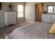 Comfortable main bedroom with nice furnishings and ample natural light through the bright window at 11702 Tetrafin Dr, Riverview, FL 33579