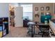 Office featuring a desk, shelving, carpet, and a closet space with ample storage and organization at 11702 Tetrafin Dr, Riverview, FL 33579