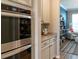 Walk-in pantry with organized shelving next to built in oven for ample storage space at 11702 Tetrafin Dr, Riverview, FL 33579