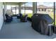 Relaxing screened patio features comfortable seating and a grill for outdoor enjoyment at 11702 Tetrafin Dr, Riverview, FL 33579