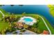 Aerial view of the community pool, clubhouse, and sun deck overlooking a beautiful pond at 11702 Tetrafin Dr, Riverview, FL 33579
