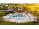 Gorgeous community pool surrounded by many lounge chairs and lush landscaping at 11702 Tetrafin Dr, Riverview, FL 33579