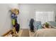 Functional entryway with hats and jackets hanging on a coat rack and a neutral colored rug at 12971 Tigers Eye Dr, Venice, FL 34292