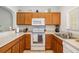 Well-equipped kitchen features matching appliances, tile flooring, and lots of cabinet space at 12971 Tigers Eye Dr, Venice, FL 34292