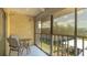 Balcony with tile floor, seating and a view of the complex at 1330 Glen Oaks E Dr # 374D, Sarasota, FL 34232