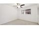 Well-lit bedroom featuring neutral carpet, ceiling fan and window with blinds at 1330 Glen Oaks E Dr # 374D, Sarasota, FL 34232