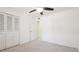 Bright bedroom with ceiling fan, neutral carpet and closet at 1330 Glen Oaks E Dr # 374D, Sarasota, FL 34232