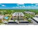 An exterior view of a condo building with a swimming pool and carport parking at 1330 Glen Oaks E Dr # 374D, Sarasota, FL 34232