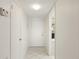 A white interior hallway and entry door of a condo unit at 1330 Glen Oaks E Dr # 374D, Sarasota, FL 34232