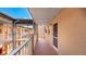 A condo hallway with outdoor access, showing the exterior of the unit at 1330 Glen Oaks E Dr # 374D, Sarasota, FL 34232