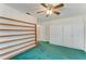 Bedroom with wall storage and wall to wall carpet at 13615 4Th Ne Ave, Bradenton, FL 34212