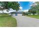 Single story home with 3-car garage, large driveway and landscaped front yard at 13615 4Th Ne Ave, Bradenton, FL 34212