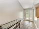Welcoming entryway with tile flooring and a glass console table at 13615 4Th Ne Ave, Bradenton, FL 34212