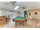 Spacious game room features a pool table, wet bar, and sliding doors to the outdoors at 13615 4Th Ne Ave, Bradenton, FL 34212