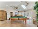 Spacious game room features a pool table, wet bar, and tile flooring at 13615 4Th Ne Ave, Bradenton, FL 34212
