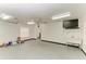 Spacious garage featuring a ceiling fan, utility sink, and lots of open space at 13615 4Th Ne Ave, Bradenton, FL 34212