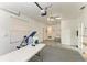 Spacious garage featuring ceiling fan and access to a sink and storage area at 13615 4Th Ne Ave, Bradenton, FL 34212