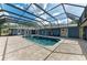 Beautiful screened-in pool area with large pool, and brick paver deck at 13615 4Th Ne Ave, Bradenton, FL 34212