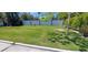 Backyard with manicured green grass and privacy fence at 1654 Blakemore Ln, Sarasota, FL 34231