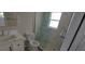 Well-lit bathroom features a modern vanity, updated fixtures, glass shower, and neutral finishes at 1654 Blakemore Ln, Sarasota, FL 34231