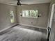 Cozy bedroom with neutral paint, tile floors and two windows at 1654 Blakemore Ln, Sarasota, FL 34231