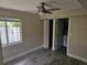 Comfortable bedroom with a ceiling fan, window, and closet at 1654 Blakemore Ln, Sarasota, FL 34231
