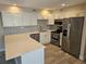 Modern kitchen featuring stainless steel appliances and white cabinetry at 1654 Blakemore Ln, Sarasota, FL 34231