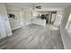 Open-concept kitchen and living area with stylish tile flooring at 1654 Blakemore Ln, Sarasota, FL 34231