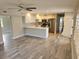 Spacious kitchen with breakfast bar and stainless steel appliances open to living area at 1654 Blakemore Ln, Sarasota, FL 34231