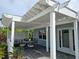 Relaxing covered patio with comfortable seating and garden views at 1654 Blakemore Ln, Sarasota, FL 34231