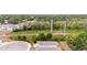 Aerial view of property's roof, backyard, with trees, bushes, and utilities at 1800 Little Bird Ct, Sarasota, FL 34235