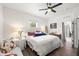 Comfortable bedroom with bright white walls and a cozy sitting area at 1800 Little Bird Ct, Sarasota, FL 34235
