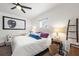 Bright bedroom with white walls, hardwood floors, and decoratively framed picture at 1800 Little Bird Ct, Sarasota, FL 34235