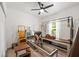 Exercise room featuring workout equipment, hardwood floors, and a ceiling fan at 1800 Little Bird Ct, Sarasota, FL 34235