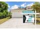 Attractive home featuring an attached garage, and lush landscaping at 1800 Little Bird Ct, Sarasota, FL 34235