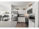 Bright kitchen featuring stainless steel appliances and light countertops at 1800 Little Bird Ct, Sarasota, FL 34235