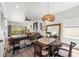 Bright open-concept living room with decor, hardwood floors, and natural light at 1800 Little Bird Ct, Sarasota, FL 34235