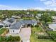 Expansive aerial view of a charming home, showcasing the well-manicured lawn and mature trees at 1828 Mova St, Sarasota, FL 34231