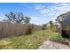 Private backyard featuring a wood fence, some green space, and a small brick patio at 1828 Mova St, Sarasota, FL 34231