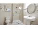 Bathroom featuring a walk-in shower, vanity sink, and modern toilet at 1828 Mova St, Sarasota, FL 34231