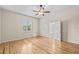 Bedroom with hardwood floors, ceiling fan, and bright window at 1828 Mova St, Sarasota, FL 34231
